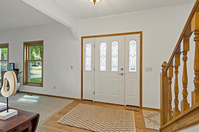 13545 Glasgow Ln, Apple Valley, MN 55124 - entrance foyer featuring stairs and light wood finished floors