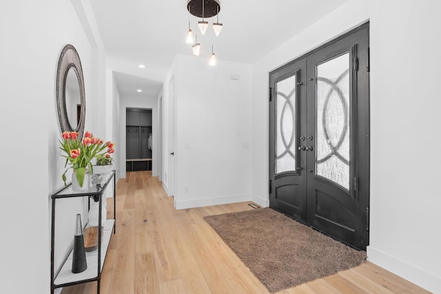 16216 Gleason Lake Rd, Minnetonka, MN 55391 - foyer with french doors, light wood finished floors, baseboards, and recessed lighting