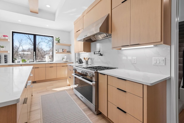 16216 Gleason Lake Rd, Minnetonka, MN 55391 - kitchen featuring wall chimney range hood, stainless steel stove, open shelves, light brown cabinets, and recessed lighting