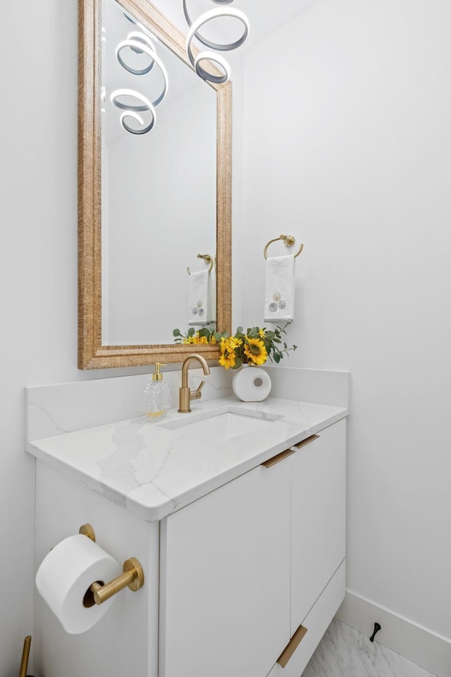 16216 Gleason Lake Rd, Minnetonka, MN 55391 - bathroom with vanity, marble look tile flooring, and baseboards