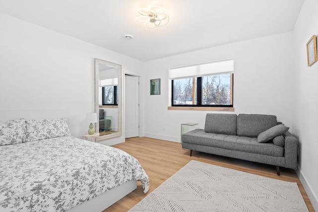 16216 Gleason Lake Rd, Minnetonka, MN 55391 - bedroom with light wood finished floors and baseboards