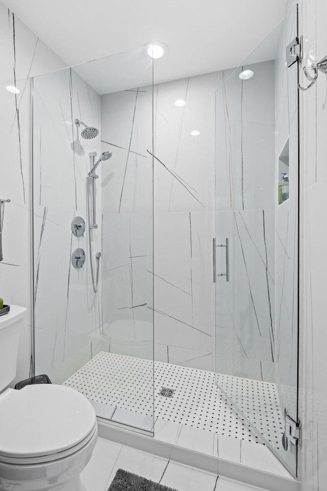 16216 Gleason Lake Rd, Minnetonka, MN 55391 - bathroom featuring a marble finish shower, toilet, and tile patterned floors