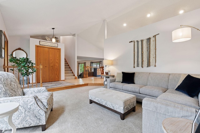 1378 Dunsmore Dr, Waconia, MN 55387 - carpeted living area with lofted ceiling, stairway, and recessed lighting