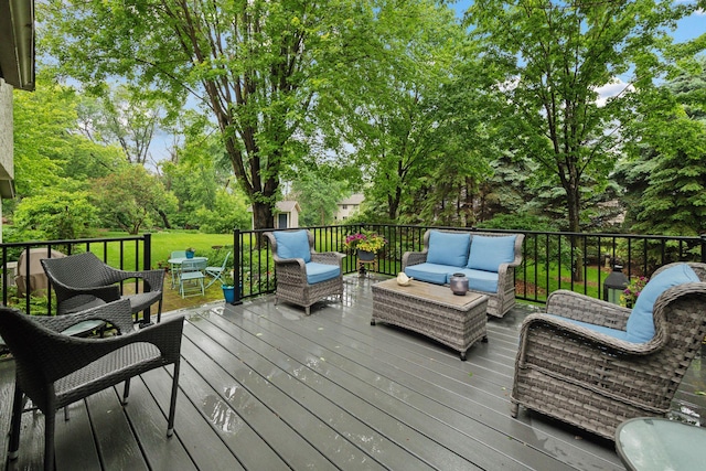 1378 Dunsmore Dr, Waconia, MN 55387 - wooden terrace with outdoor lounge area, view of wooded area, and outdoor dining area