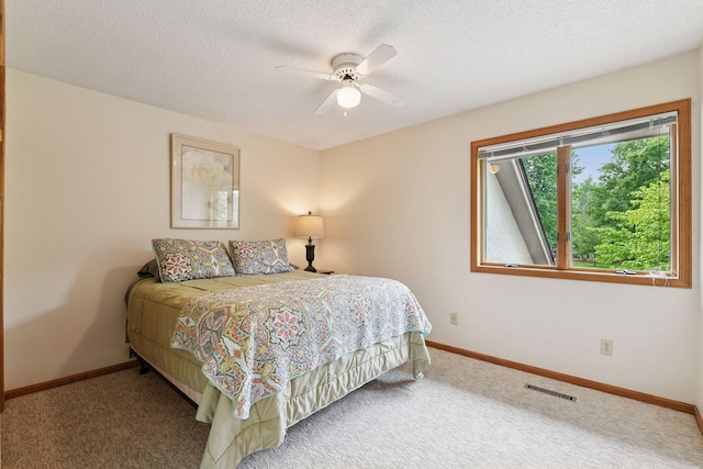 1378 Dunsmore Dr, Waconia, MN 55387 - carpeted bedroom featuring baseboards, a textured ceiling, and ceiling fan