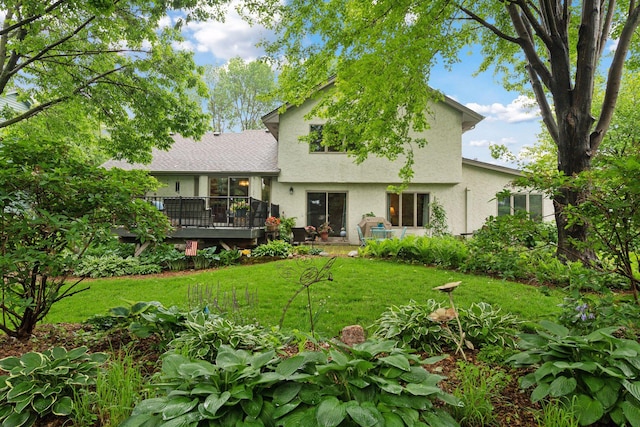 1378 Dunsmore Dr, Waconia, MN 55387 - back of property with stucco siding, a wooden deck, and a lawn