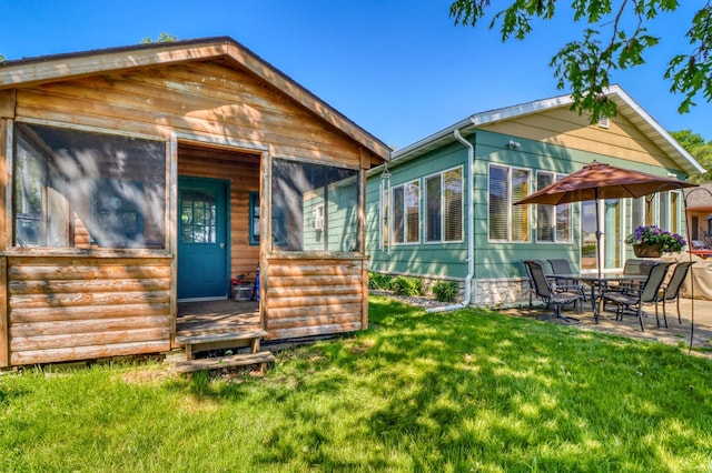 25934 Brolin Beach Rd, Detroit Twp, MN 56501 - view of front of home with a front lawn and a patio area