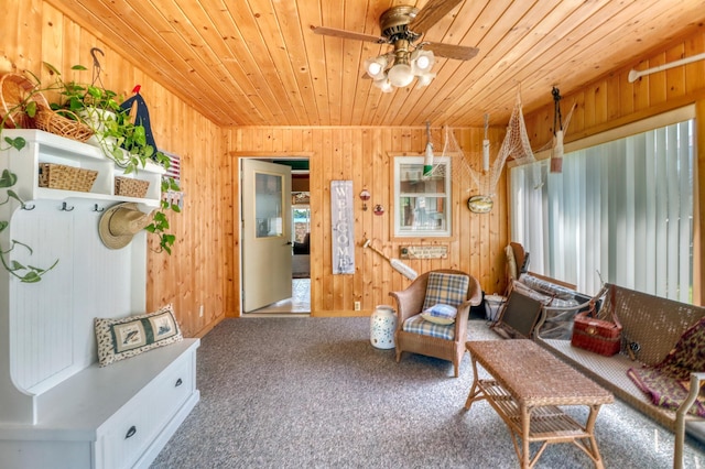 25934 Brolin Beach Rd, Detroit Twp, MN 56501 - living area featuring wooden ceiling, wooden walls, ceiling fan, and carpet