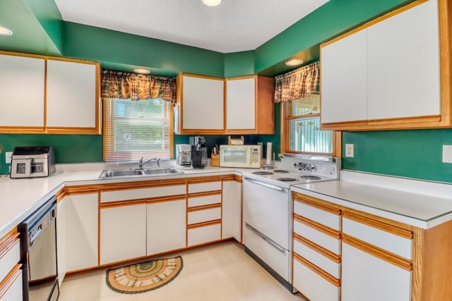 25934 Brolin Beach Rd, Detroit Twp, MN 56501 - kitchen featuring white appliances, a sink, white cabinets, light countertops, and a textured ceiling