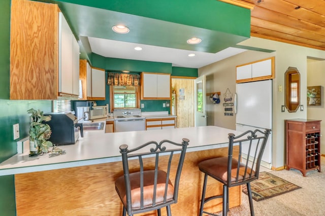25934 Brolin Beach Rd, Detroit Twp, MN 56501 - kitchen with white appliances, a peninsula, a sink, light countertops, and white cabinets