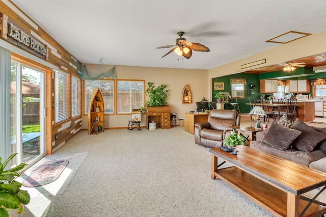 25934 Brolin Beach Rd, Detroit Twp, MN 56501 - living area featuring a ceiling fan, light carpet, and baseboards