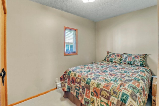 25934 Brolin Beach Rd, Detroit Twp, MN 56501 - carpeted bedroom featuring a textured ceiling
