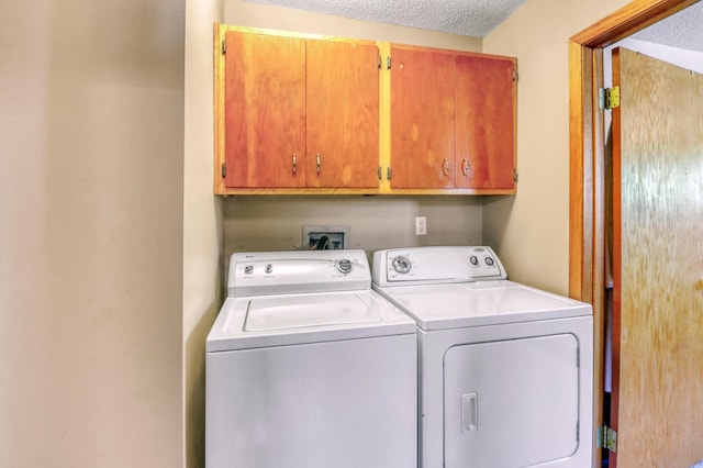 25934 Brolin Beach Rd, Detroit Twp, MN 56501 - washroom with cabinet space, washer and clothes dryer, and a textured ceiling