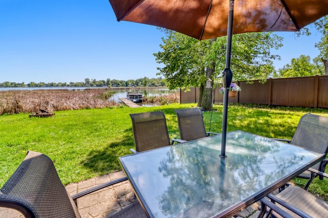 25934 Brolin Beach Rd, Detroit Twp, MN 56501 - view of yard with outdoor dining space and a water view