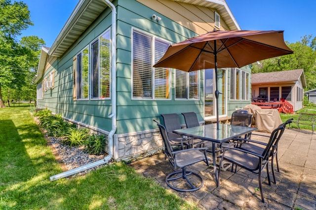 25934 Brolin Beach Rd, Detroit Twp, MN 56501 - view of patio / terrace with outdoor dining area