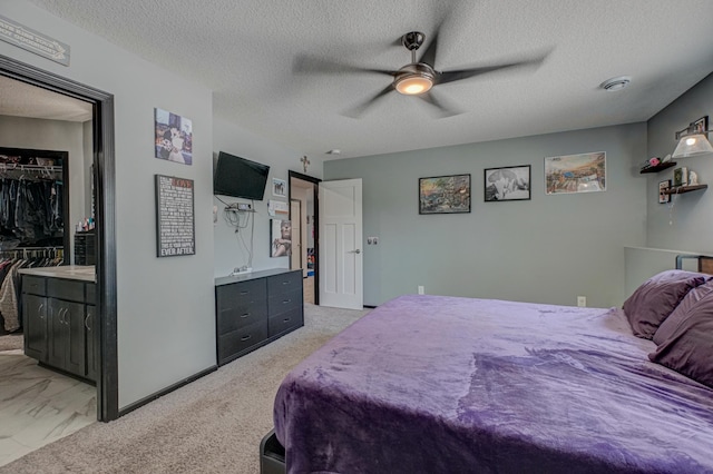 17690 Clayton Ave E, Vermillion Twp, MN 55068 - bedroom with a textured ceiling, a spacious closet, and ceiling fan