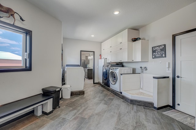 17690 Clayton Ave E, Vermillion Twp, MN 55068 - washroom featuring cabinet space, independent washer and dryer, recessed lighting, and wood tiled floors