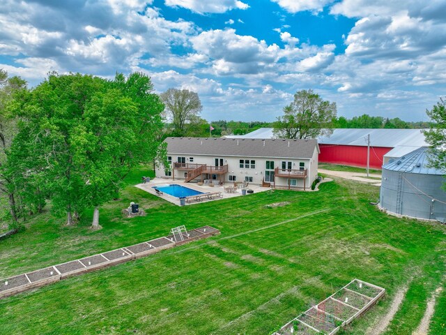 17690 Clayton Ave E, Vermillion Twp, MN 55068 - back of property with a deck, stairway, a patio area, and a yard