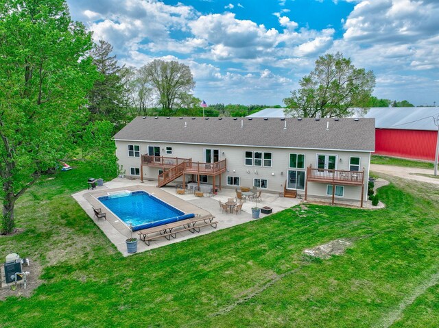 17690 Clayton Ave E, Vermillion Twp, MN 55068 - rear view of house with a deck, a patio area, a yard, an outdoor pool, and stairs
