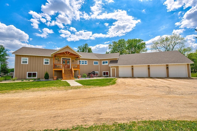 17690 Clayton Ave E, Vermillion Twp, MN 55068 - view of front facade with driveway, board and batten siding, and stairway