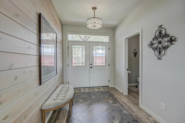 17690 Clayton Ave E, Vermillion Twp, MN 55068 - foyer entrance with a chandelier, wood finished floors, french doors, and baseboards