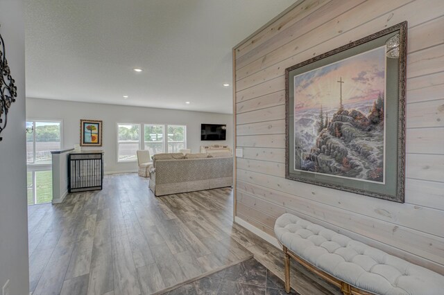 17690 Clayton Ave E, Vermillion Twp, MN 55068 - living room with wooden walls, baseboards, recessed lighting, and wood finished floors