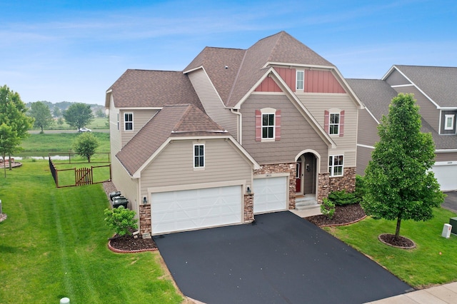 14111 Abercorn Ave, Rosemount, MN 55068 - craftsman-style home with stone siding, driveway, a garage, a shingled roof, and board and batten siding
