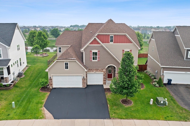 14111 Abercorn Ave, Rosemount, MN 55068 - view of front of property with driveway, stone siding, board and batten siding, cooling unit, and a front lawn