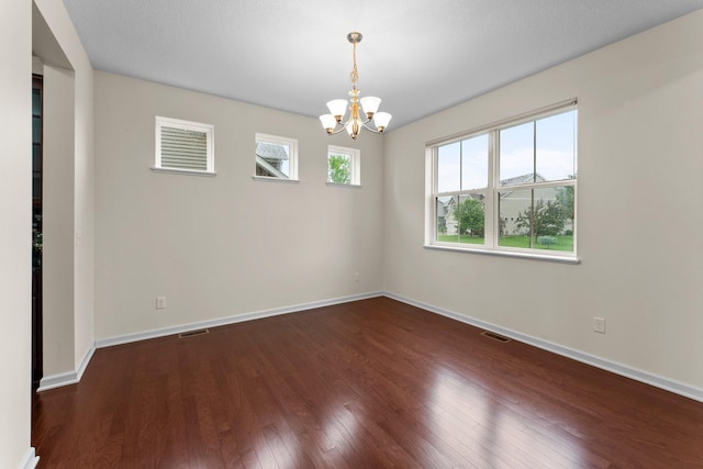 14111 Abercorn Ave, Rosemount, MN 55068 - empty room featuring a chandelier, wood finished floors, and baseboards