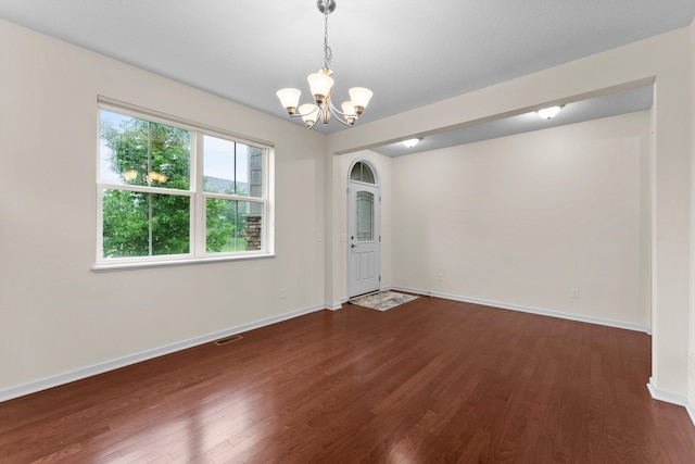14111 Abercorn Ave, Rosemount, MN 55068 - unfurnished dining area with a chandelier, dark wood finished floors, and baseboards