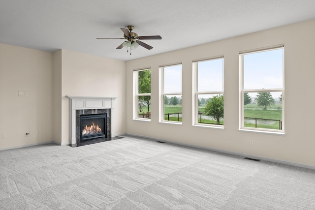 14111 Abercorn Ave, Rosemount, MN 55068 - unfurnished living room with carpet flooring, a fireplace, a ceiling fan, and baseboards