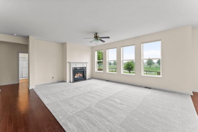 14111 Abercorn Ave, Rosemount, MN 55068 - unfurnished living room featuring a premium fireplace, ceiling fan, baseboards, and wood finished floors