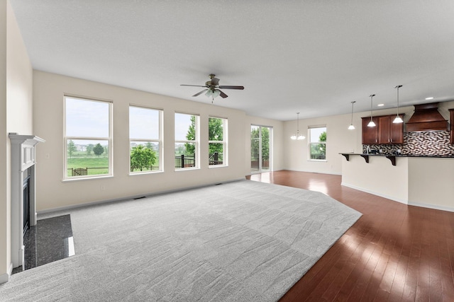 14111 Abercorn Ave, Rosemount, MN 55068 - living area featuring ceiling fan, a high end fireplace, baseboards, and dark wood finished floors