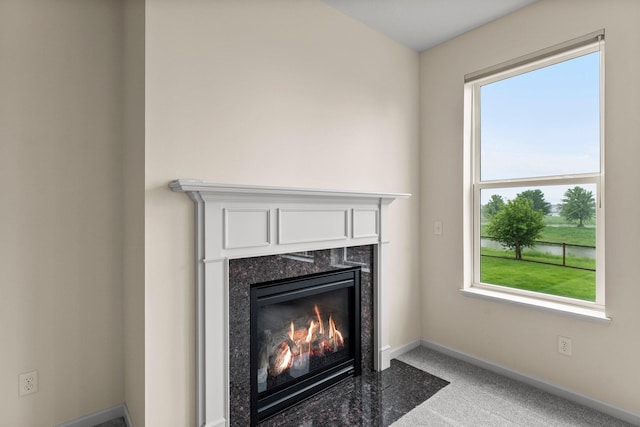 14111 Abercorn Ave, Rosemount, MN 55068 - detailed view of a fireplace, baseboards, and carpet flooring