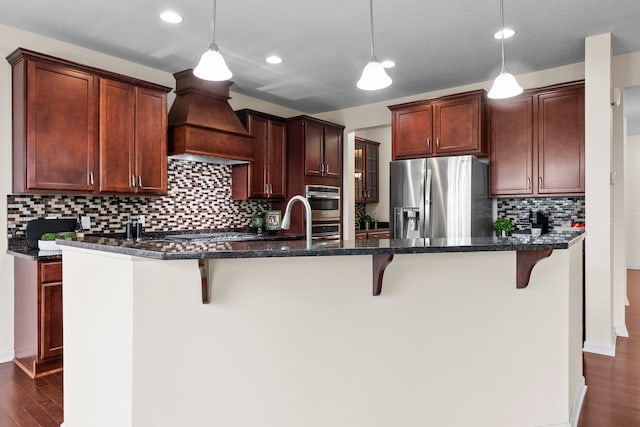 14111 Abercorn Ave, Rosemount, MN 55068 - kitchen featuring appliances with stainless steel finishes, custom range hood, backsplash, a breakfast bar, and recessed lighting