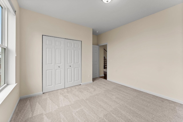 14111 Abercorn Ave, Rosemount, MN 55068 - unfurnished bedroom with carpet, a closet, and baseboards