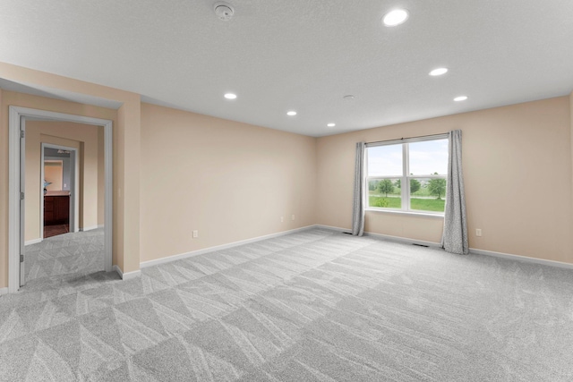 14111 Abercorn Ave, Rosemount, MN 55068 - unfurnished room with light colored carpet, recessed lighting, baseboards, and a smoke detector