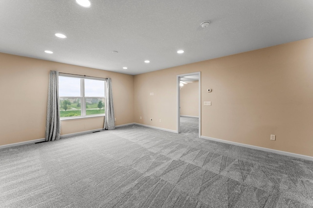 14111 Abercorn Ave, Rosemount, MN 55068 - spare room featuring light colored carpet, recessed lighting, baseboards, a smoke detector, and a textured ceiling