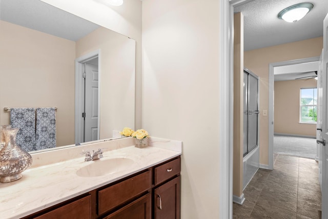 14111 Abercorn Ave, Rosemount, MN 55068 - bathroom with vanity, shower / bath combination with glass door, and baseboards