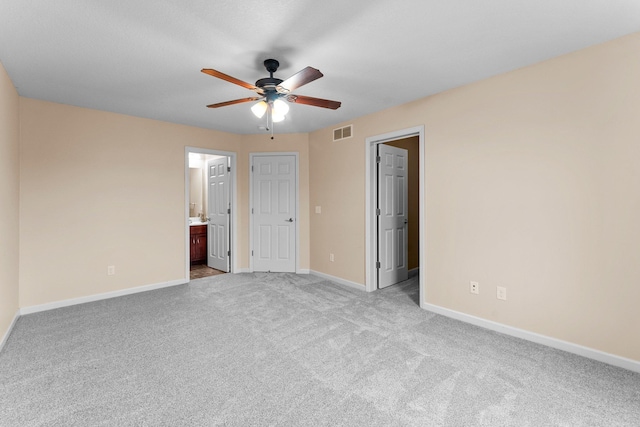 14111 Abercorn Ave, Rosemount, MN 55068 - unfurnished bedroom featuring carpet, baseboards, connected bathroom, and ceiling fan
