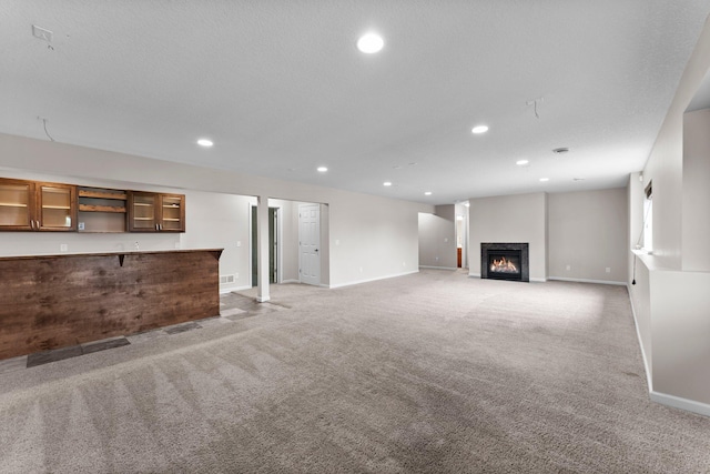 14111 Abercorn Ave, Rosemount, MN 55068 - unfurnished living room with light carpet, baseboards, recessed lighting, and a lit fireplace