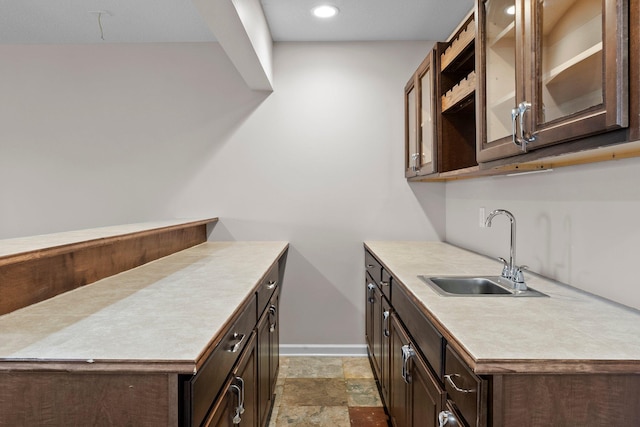 14111 Abercorn Ave, Rosemount, MN 55068 - washroom featuring a sink, baseboards, light stone finish flooring, and recessed lighting