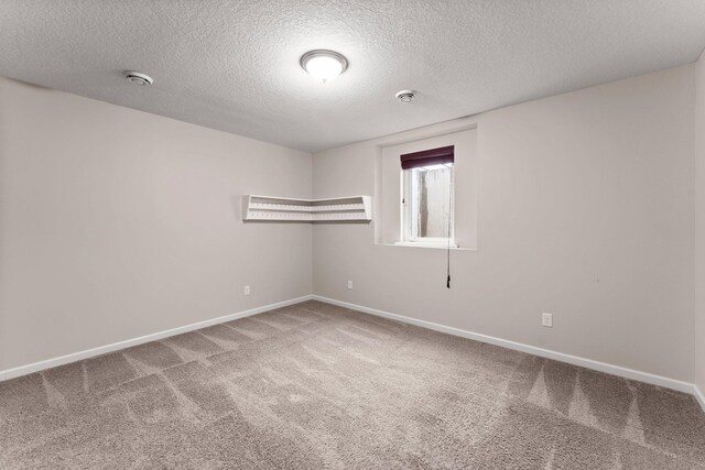 14111 Abercorn Ave, Rosemount, MN 55068 - carpeted spare room featuring a textured ceiling, a smoke detector, and baseboards