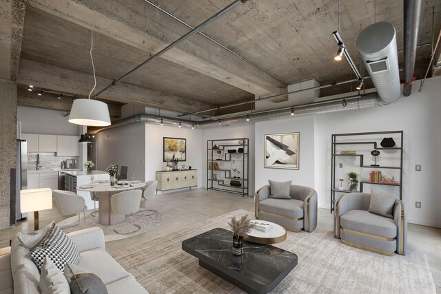 901 3rd St Unit 515, Minneapolis, MN 55401 - living room featuring concrete flooring, track lighting, and wine cooler