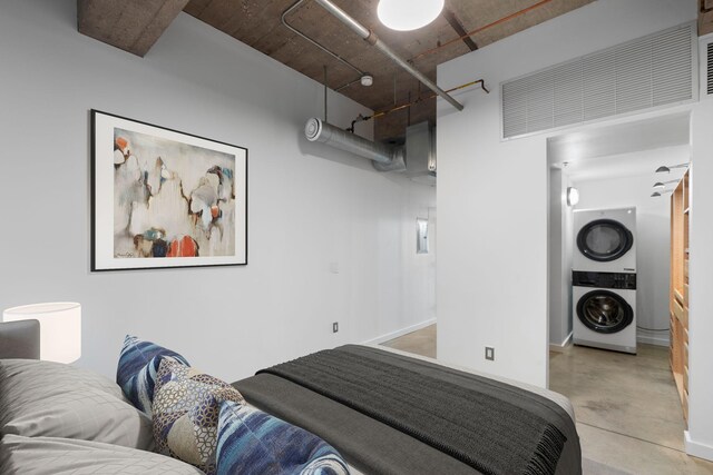 901 3rd St Unit 515, Minneapolis, MN 55401 - bedroom with stacked washer and clothes dryer and concrete flooring