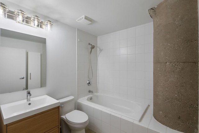 901 3rd St Unit 515, Minneapolis, MN 55401 - full bathroom featuring toilet, tiled shower / bath, and vanity