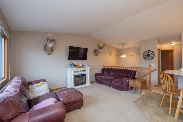 1810 41st Ave S, Moorhead, MN 56560 - living room featuring light carpet, lofted ceiling, a ceiling fan, and a fireplace