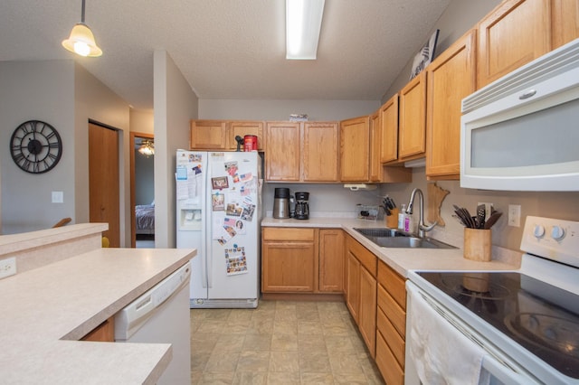 1810 41st Ave S, Moorhead, MN 56560 - kitchen featuring white appliances, a sink, light countertops, decorative light fixtures, and a textured ceiling