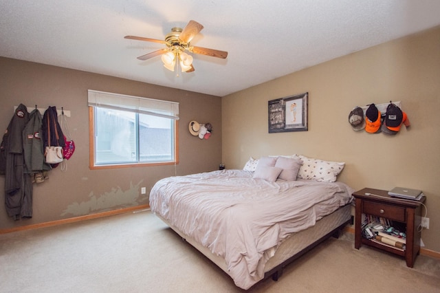 1810 41st Ave S, Moorhead, MN 56560 - carpeted bedroom with baseboards and a ceiling fan