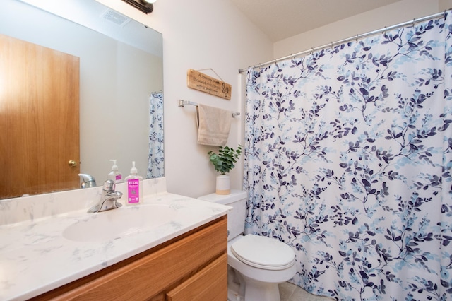1810 41st Ave S, Moorhead, MN 56560 - bathroom with toilet, vanity, and curtained shower